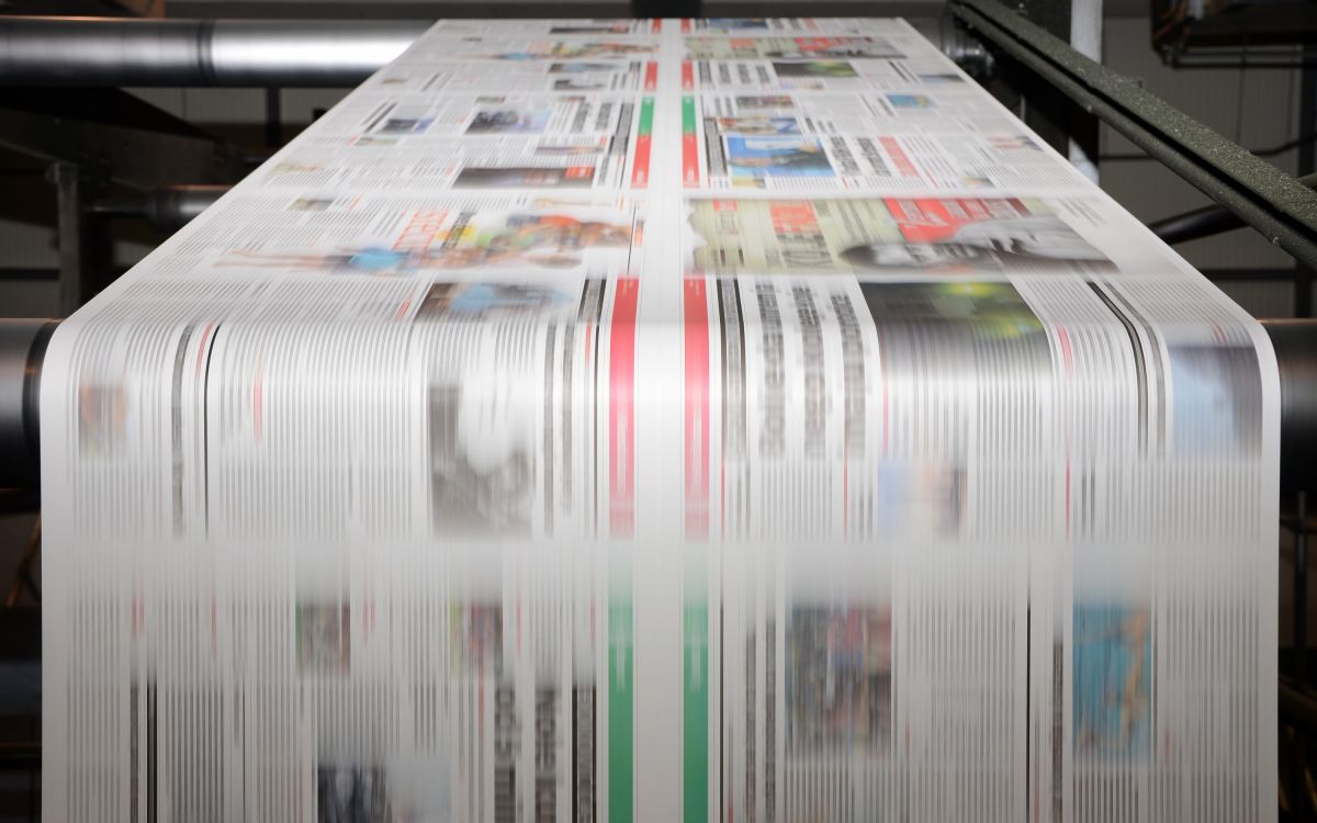 Magazine going through a printing press