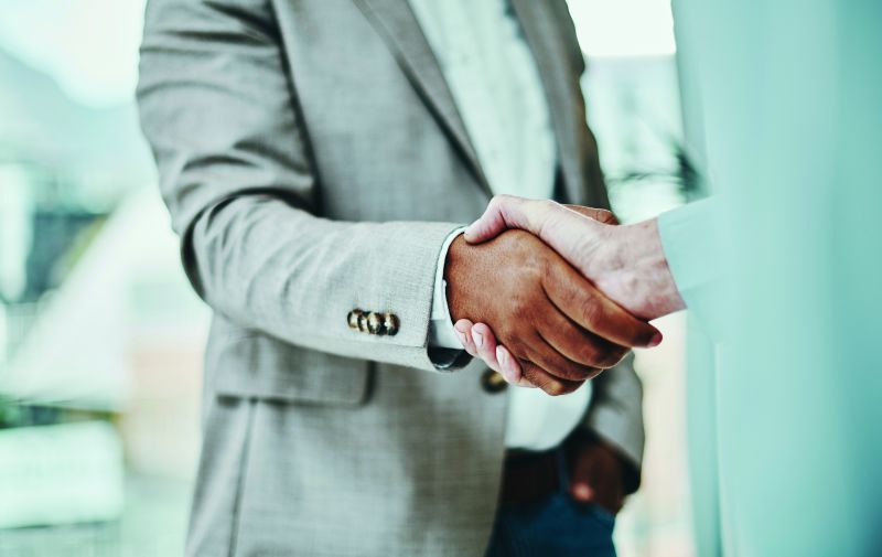 Close-up image of two people shaking hands