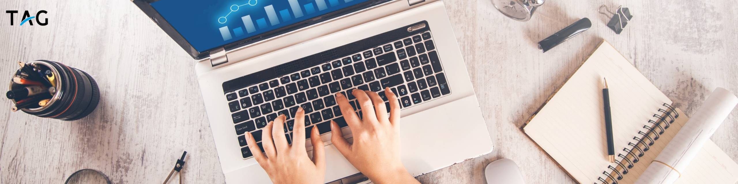 Hands hovering over a keyboard, about to head to the TAG team's website to learn about web development services.